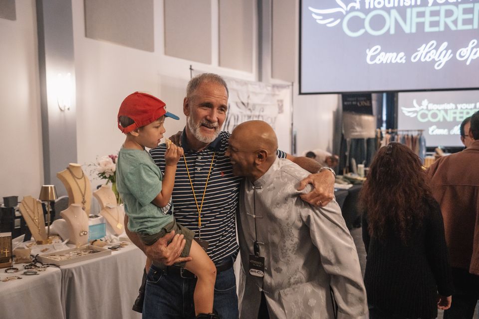 Three generations greeting one another with joy