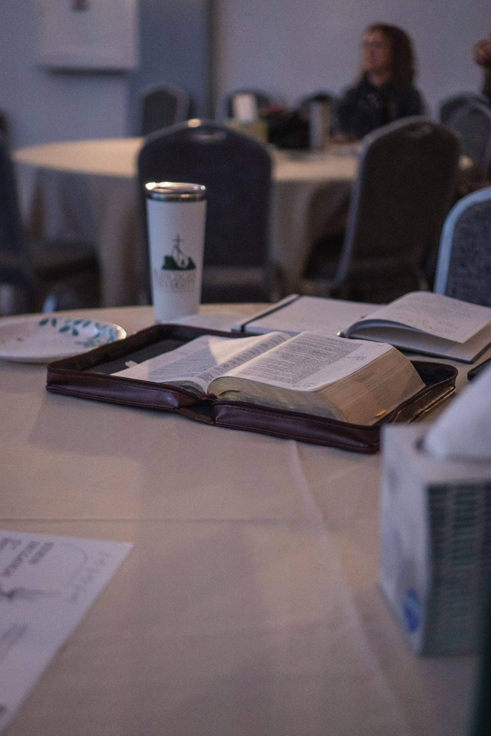 An open Bible resting on a table